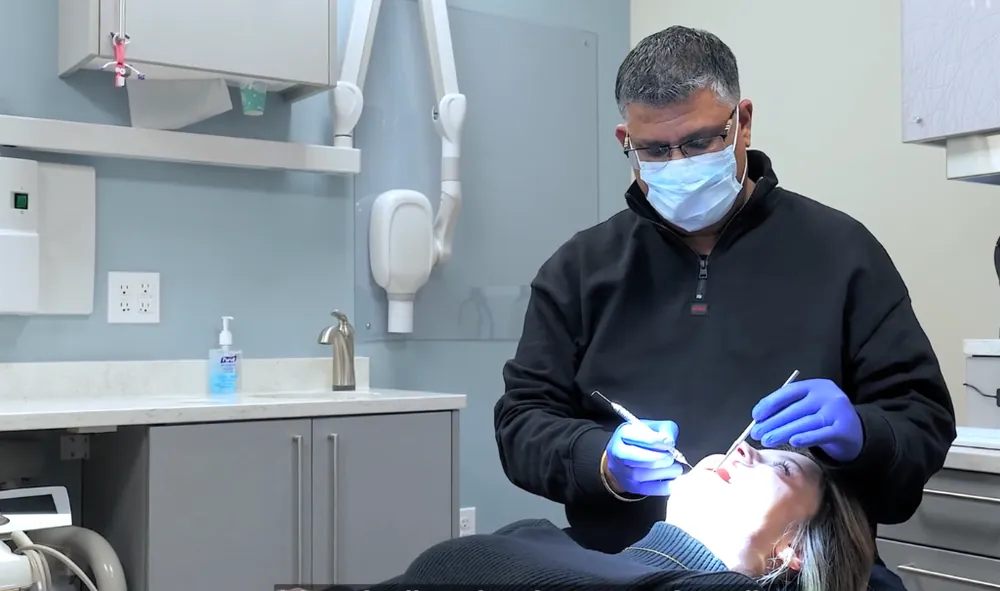 Dr. Raj-Deep Mahal performing pediatric dental exam and gentle teeth cleaning at Just 4 Kidz Dental