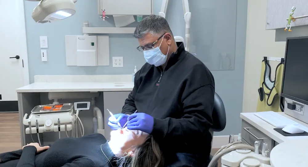 Dr. Raj-Deep Mahal performing gentle pediatric dental filling and restoration treatment at Just 4 Kidz Dental